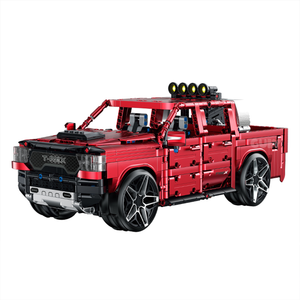 A 1,349-piece 1:14 electroplated-red off-road pickup with roof spotlights, openable doors and tailgate. Static display, RC-upgradeable for 360° drift & mist. 