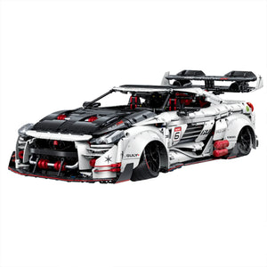 A 3,939-piece 1:8 widebody racing car in white, black & red with linkage steering and adjustable wing. Static display, RC-upgradeable with steam smoke.14+.